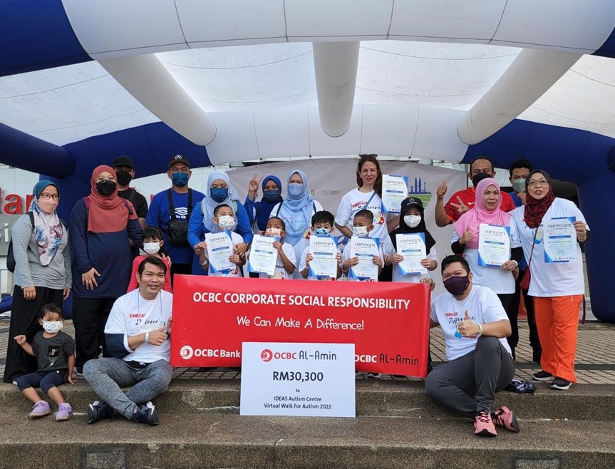 OCBC Al-Amin staff and IDEAS Autism Centre teachers and students walked together to support the cause 