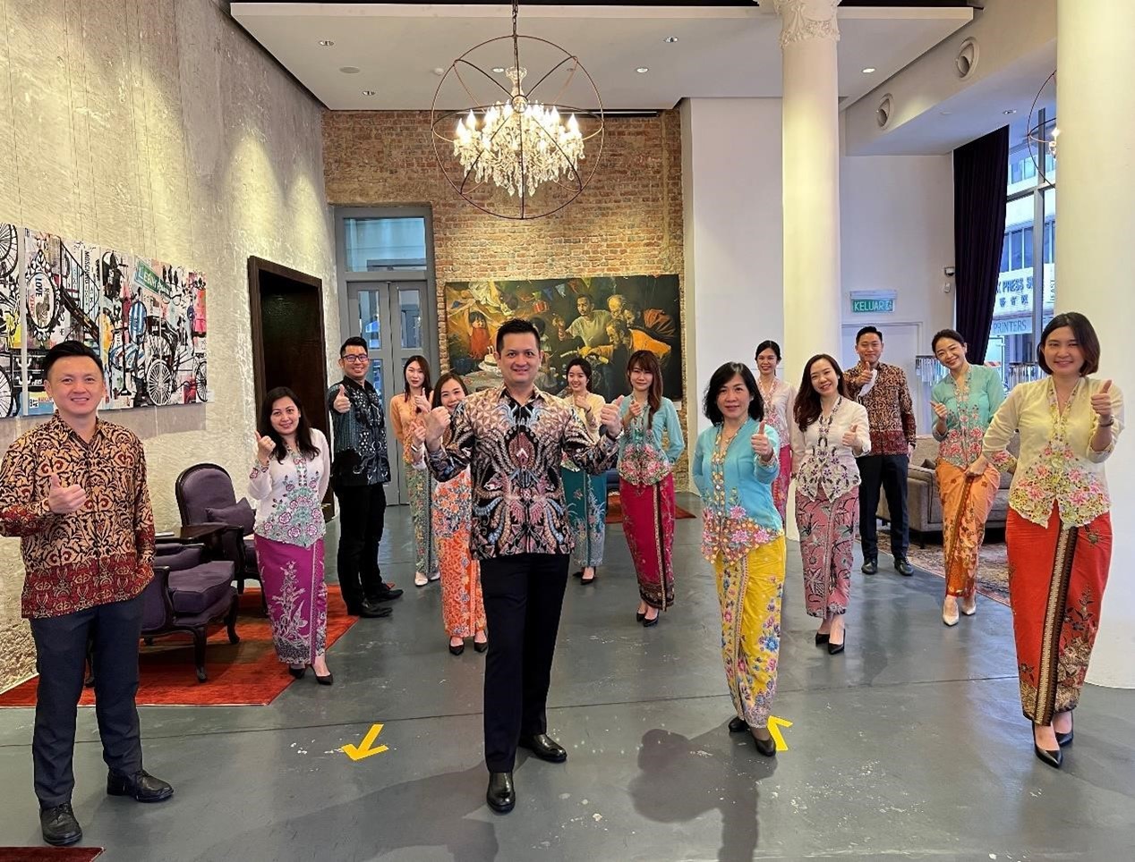 OCBC Bank Penang branch staff all decked up in their new Wednesday cultural costumes 